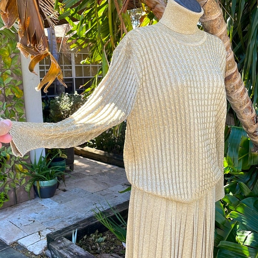 Gold metallic  cable knit  two-piece sweater and pleated…